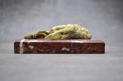Paperweight representing a dead bird, chased...