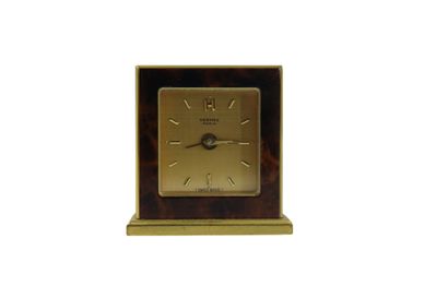HERMES. Travel alarm clock in gilt metal...