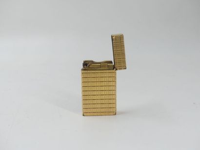 DUPONT. Lighter in gilded metal, signed and...
