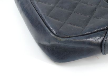 CHANEL. Small quilted camera bag in navy...