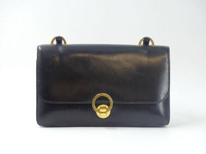 HERMES. Ring bag in black box calf, gold...