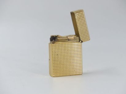 DUPONT. Lighter in gilded metal, signed and...