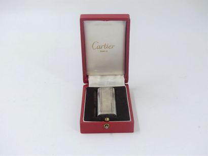 CARTIER. Lighter in silver plated metal,...