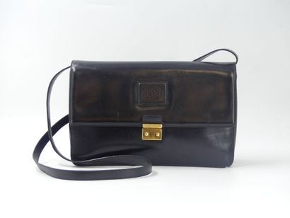GUCCI. Black leather clutch bag, gold metal...