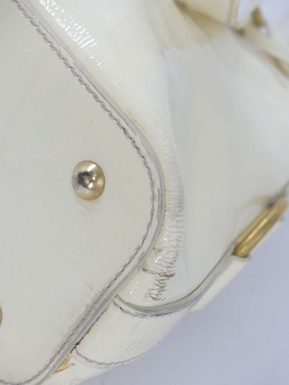 Yves Saint Laurent. Cream patent leather...