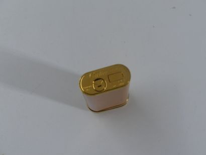 CARTIER. Lighter in orange lacquer and gold...