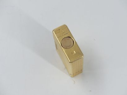 DUPONT. Lighter in gilded metal, signed and...