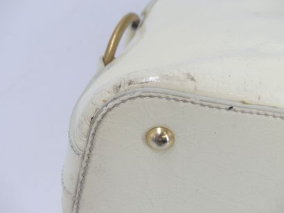 Yves Saint Laurent. Cream patent leather...