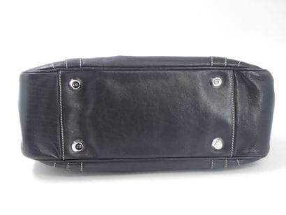 DIOR. Handbag in black calfskin, interior...