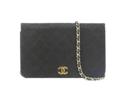CHANEL. Brown jersey clutch bag, chain handle...