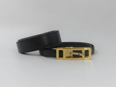 CARTIER. Black leather belt and gold metal...