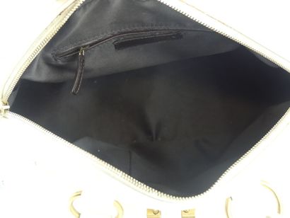 Yves Saint Laurent. Cream patent leather...