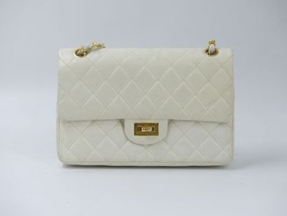 CHANEL. Classic quilted bag in white lambskin,...