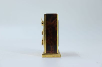 HERMES. Travel alarm clock in gilt metal...