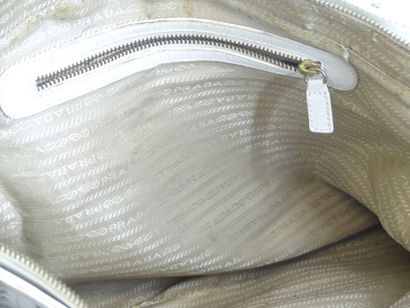 PRADA. White leather bag with bangs, inside...
