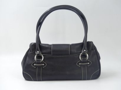 DIOR. Handbag in black calfskin, interior...