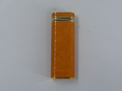 CARTIER. Lighter in orange lacquer and gold...