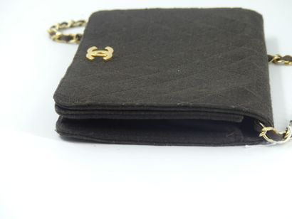 CHANEL. Brown jersey clutch bag, chain handle...