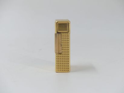 DUPONT. Lighter in gilded metal, signed and...
