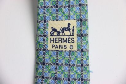 Hermes tie in its box, blue gray color. Very...
