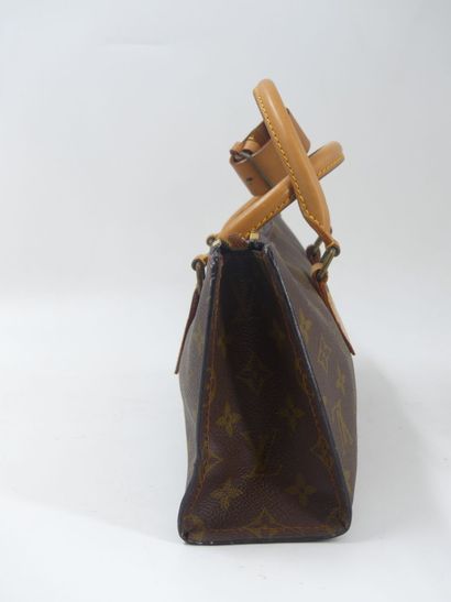 LOUIS VUITTON. Triangular bag in monogram...