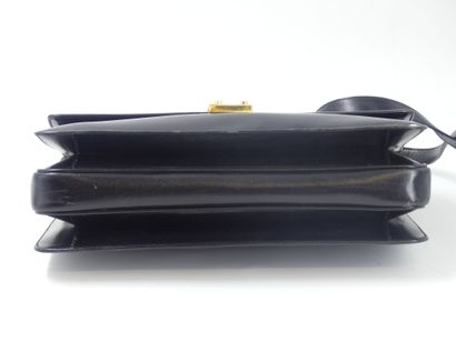 GUCCI. Black leather clutch bag, gold metal...