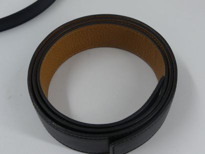 CARTIER. Black leather belt and gold metal...