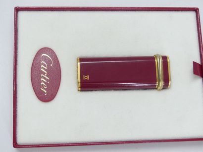 CARTIER. Must. Lighter in gilt metal and...