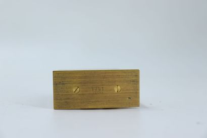 HERMES. Travel alarm clock in gilt metal...