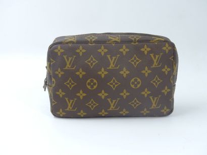 LOUIS VUITTON. Lot composed of a toiletry...