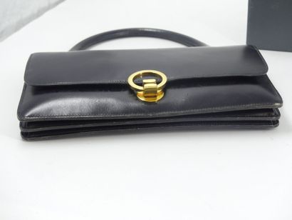 HERMES. Ring bag in black box calf, gold...