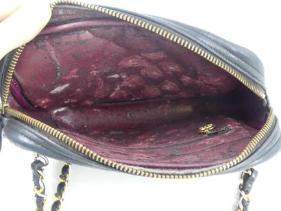 CHANEL. Small quilted camera bag in navy...