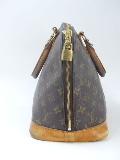 LOUIS VUITTON. Alma bag in monogram canvas...