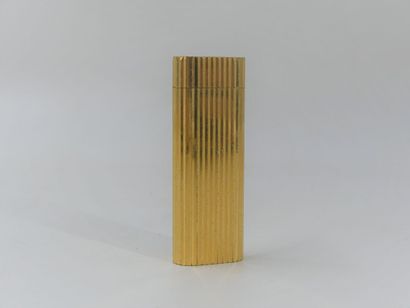 CARTIER. Lighter in gilded metal, signed...