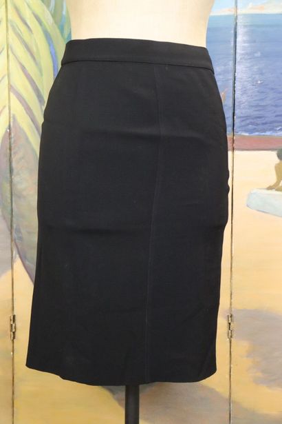 CHANEL. Meeting of two black wool skirts,...