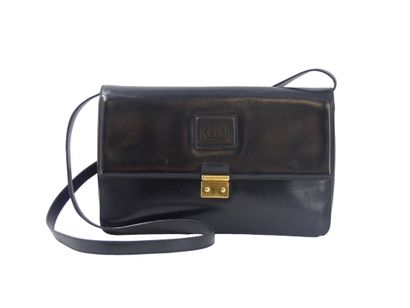 GUCCI. Black leather clutch bag, gold metal...