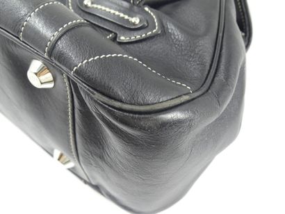 DIOR. Handbag in black calfskin, interior...