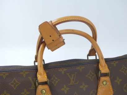 LOUIS VUITTON. Triangular bag in monogram...