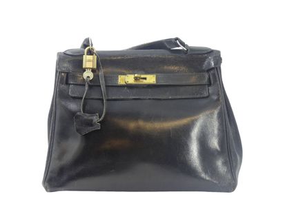 HERMES. Kelly bag 28cm in black box, gold...