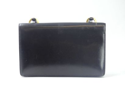 HERMES. Ring bag in black box calf, gold...