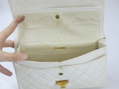CHANEL. Classic quilted bag in white lambskin,...
