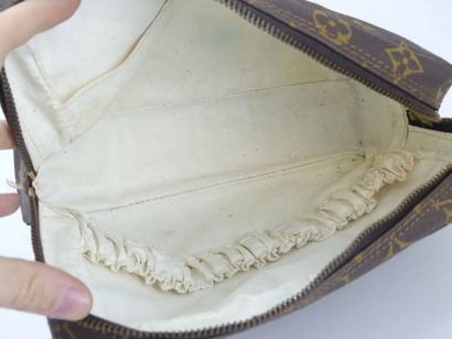 LOUIS VUITTON. Lot composed of a toiletry...