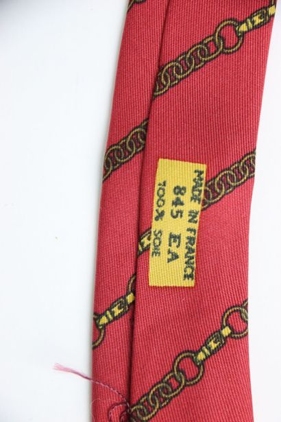 HERMES. Burgundy tie, in its box. Stain