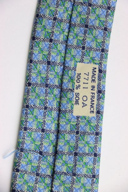 Hermes tie in its box, blue gray color. Very...