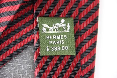 Meeting of two silk ties, one HERMES with...