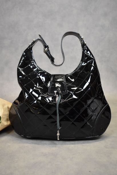 BURBERRY. Large black patent leather satchel...