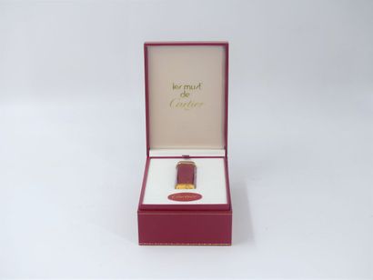 CARTIER. Must. Lighter in gilt metal and...