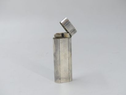 CARTIER. Lighter in silver plated metal,...