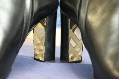 BURBERRY. Pair of black leather heeled boots,...