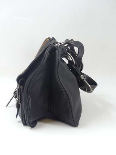 DIOR. Saddle bag in black and gold calfskin,...